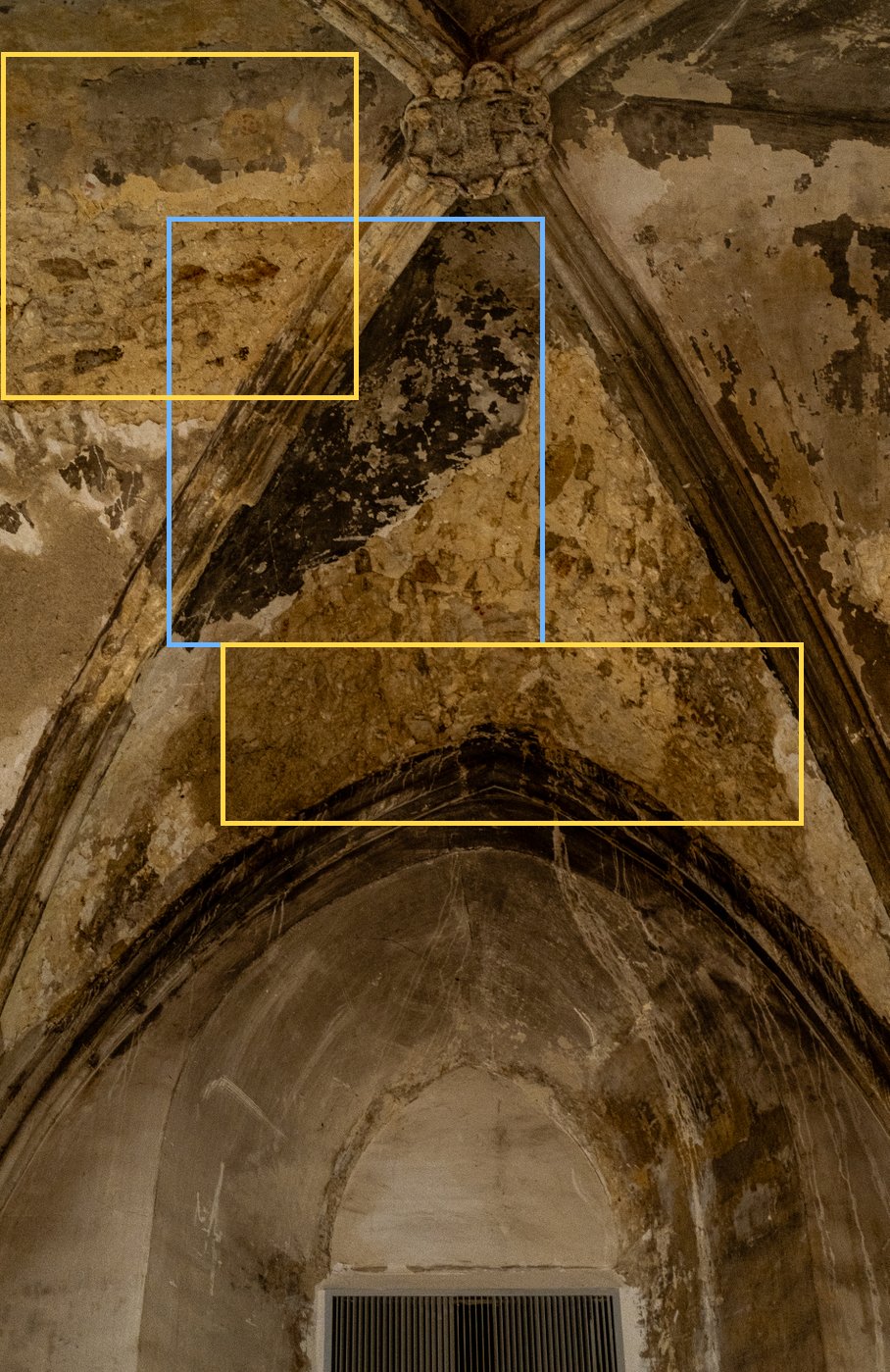 Vault cell stained by water ingress, with large areas of fallen plaster